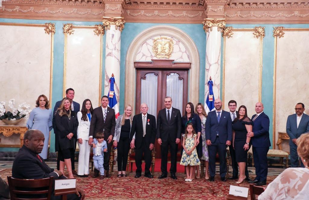 Guillo and family at the ceremony with President Abinader